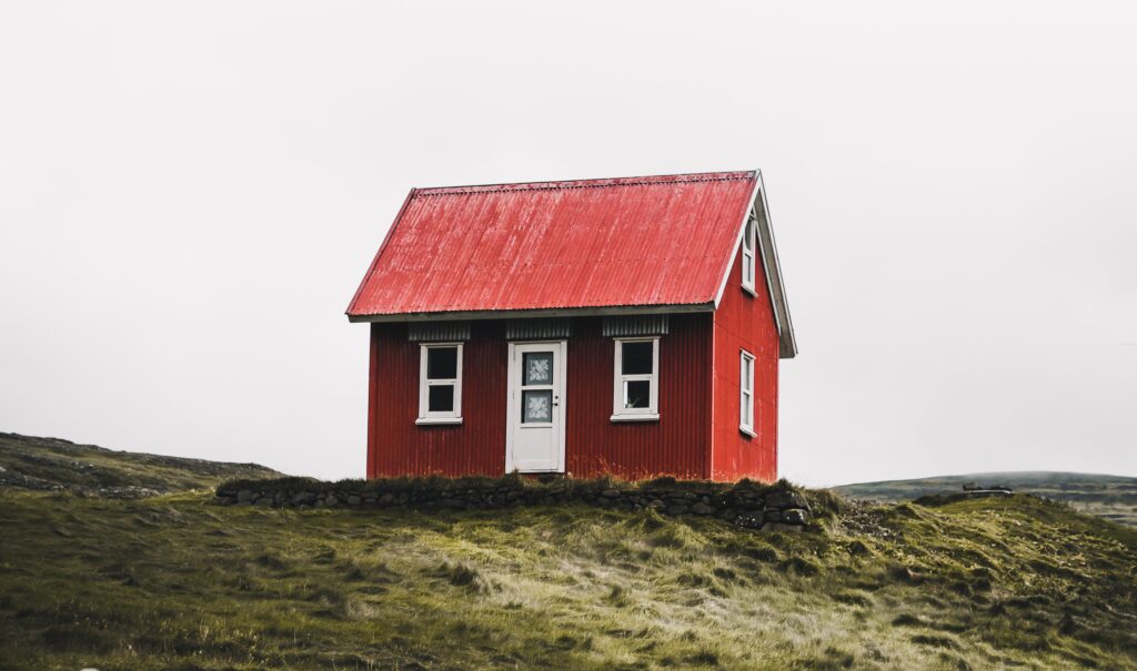 Kaufen oder mieten, rotes Haus